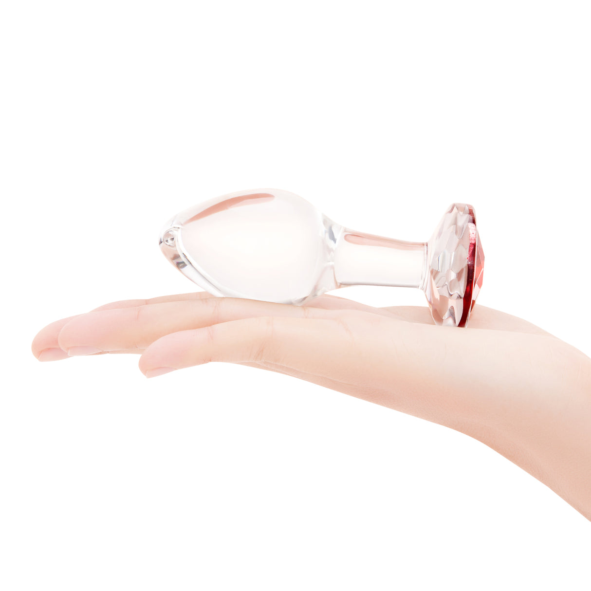 4" Cherry Sparkle Butt Plug - Large on top of palm for scale