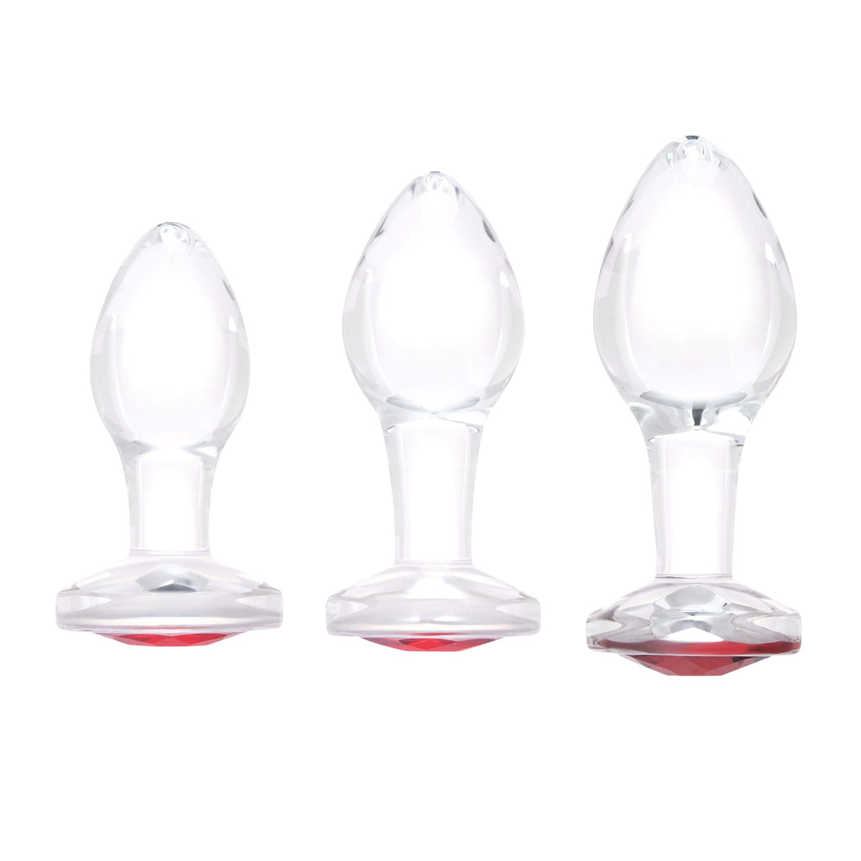 Cherry_Sparkle_Butt_Plug Three clear glass red-gem plugs grouped together to illustrate Small, Medium, and Large sizes.