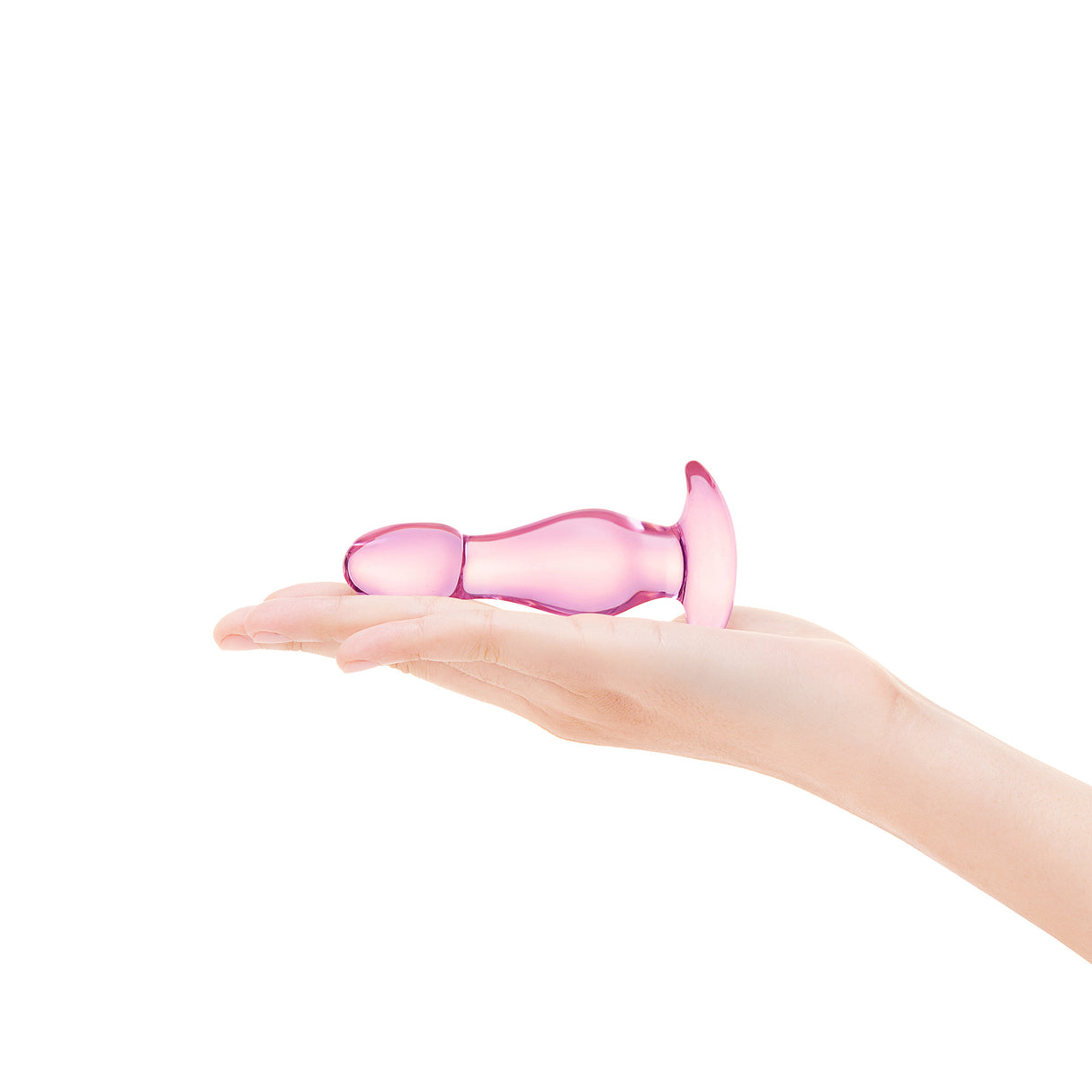 Pink silicone glass plug held in a hand on a white background