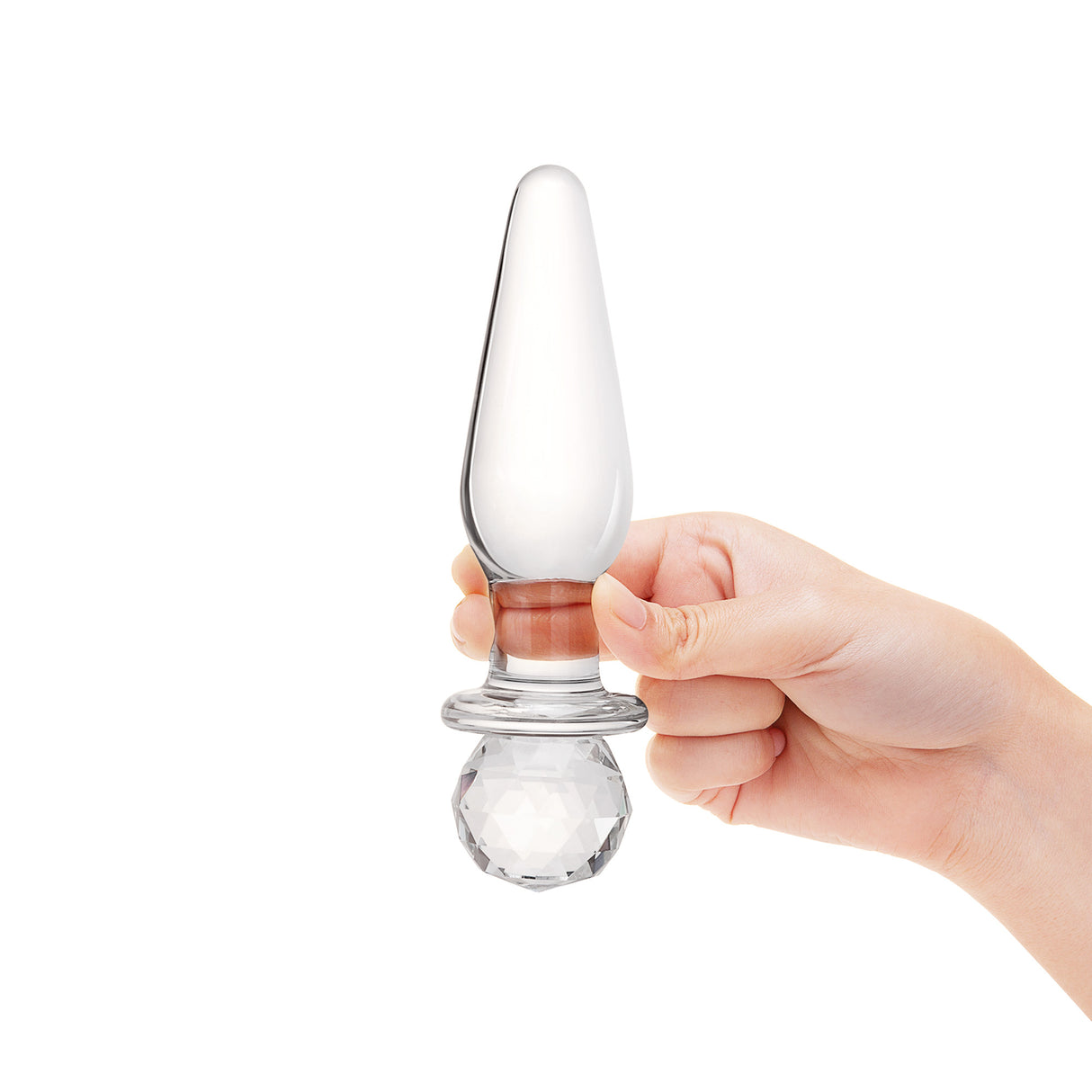 A hand holding the plug by the crystal grip to demonstrate the impressive length and the elegant balance of the toy.