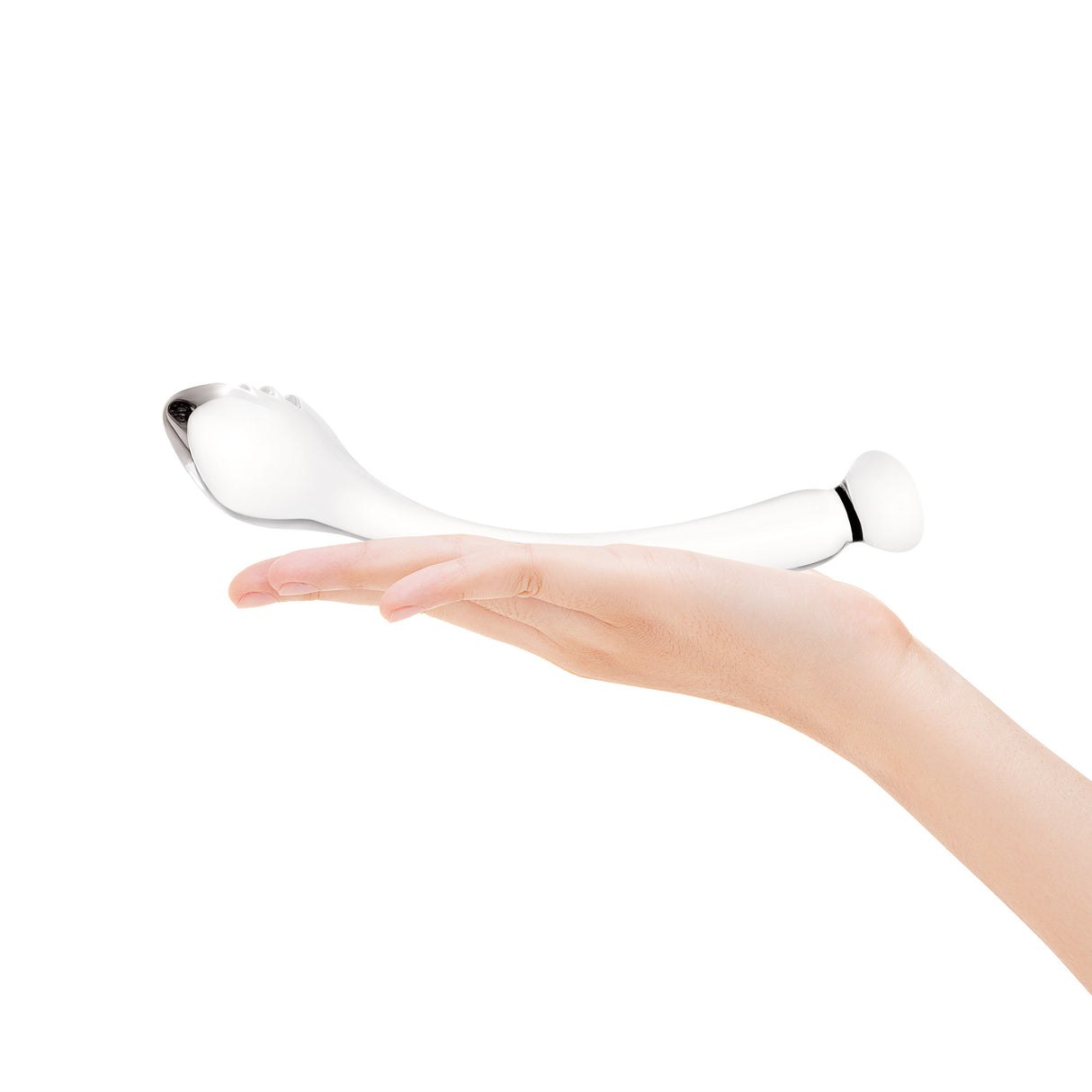 Hand holding a Clear glass dildo against a white background