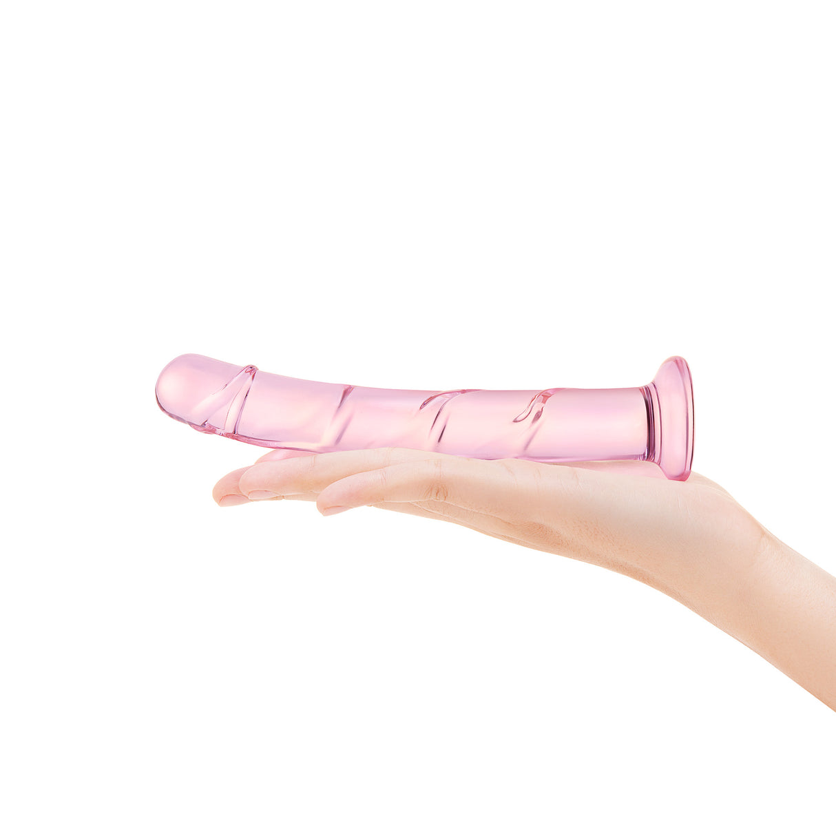 A hand holding the dildo, demonstrating the manageable 1-inch diameter and 6.6-inch length.