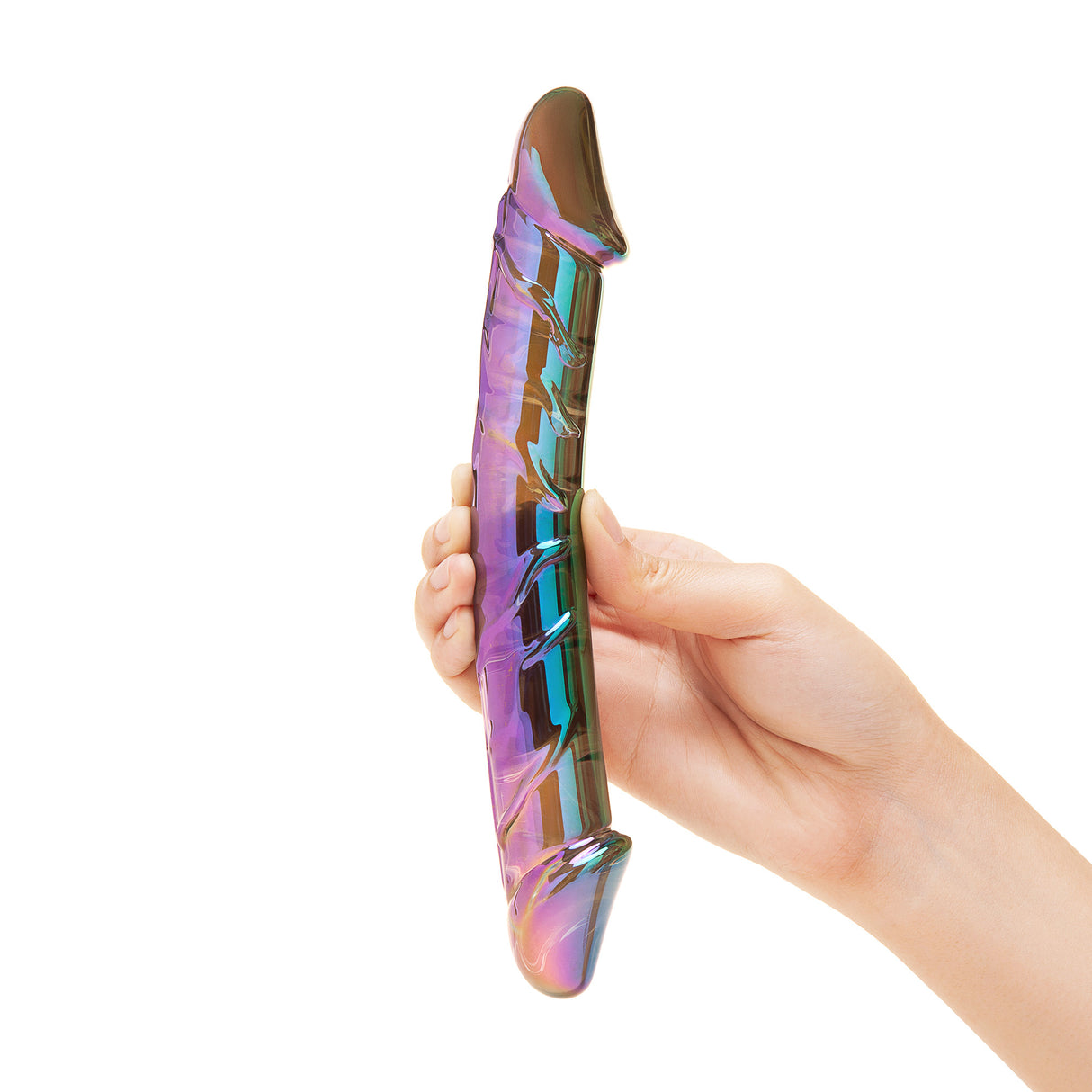 Hand holding a cMulticolored, iridescent Dual-Ended Glass Dildo against a white background