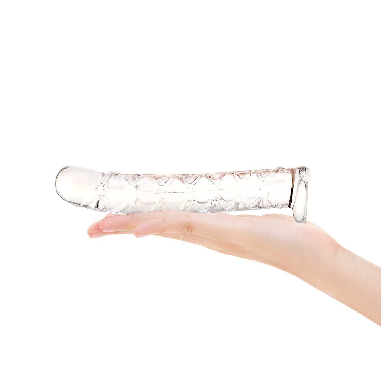 Clear glass Long Textured Glass Dildo held in a hand against a white background