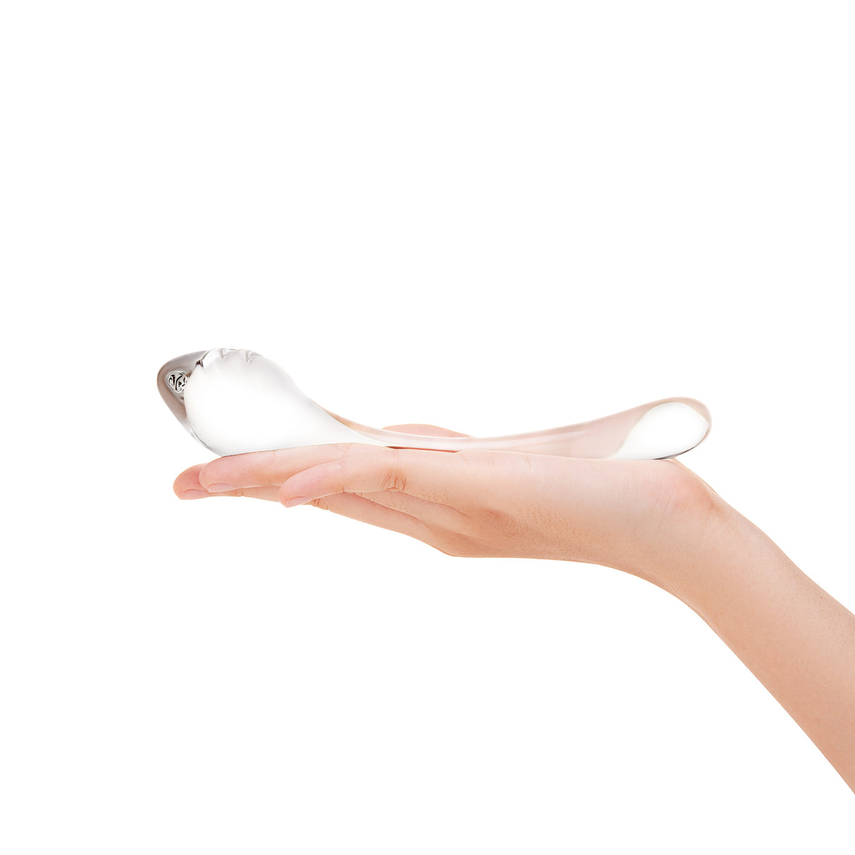 Clear G-Spot Curved Glass Dildo with teardrop-shaped textured tip on a hand against a white background