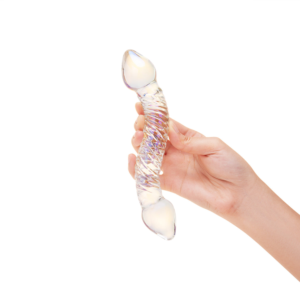 A hand holding the toy at the center to show grip, thickness, and overall length in a natural pose.