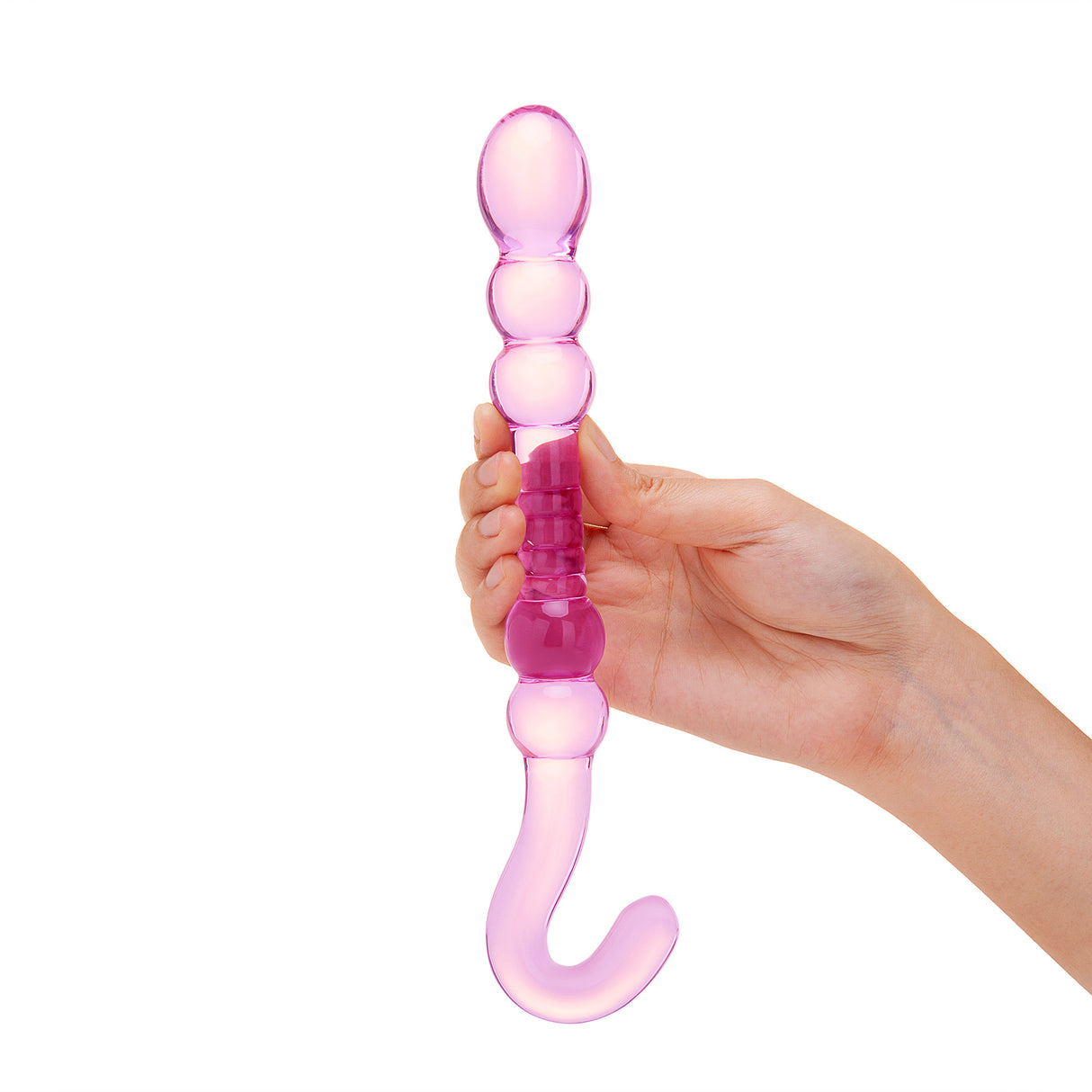 Pink Beaded Glass Dildo with rippled center, beaded shaft and hook-shaped handle held by a hand on a white background