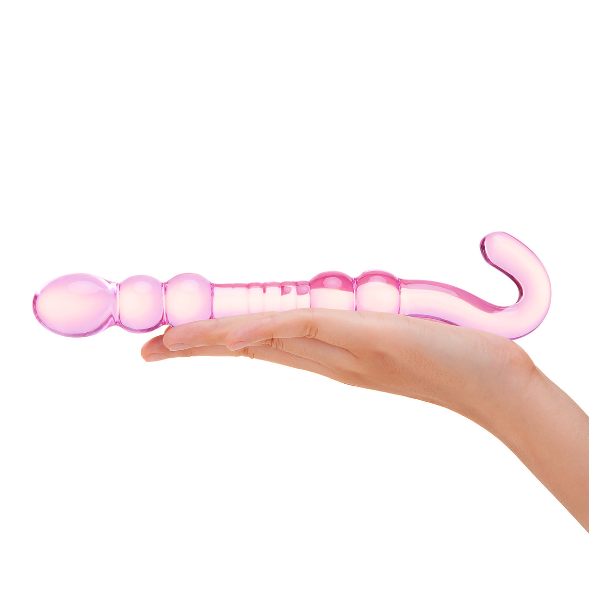 Pink Beaded Glass Dildo with rippled center, beaded shaft and hook-shaped handle held in a hand on a white background