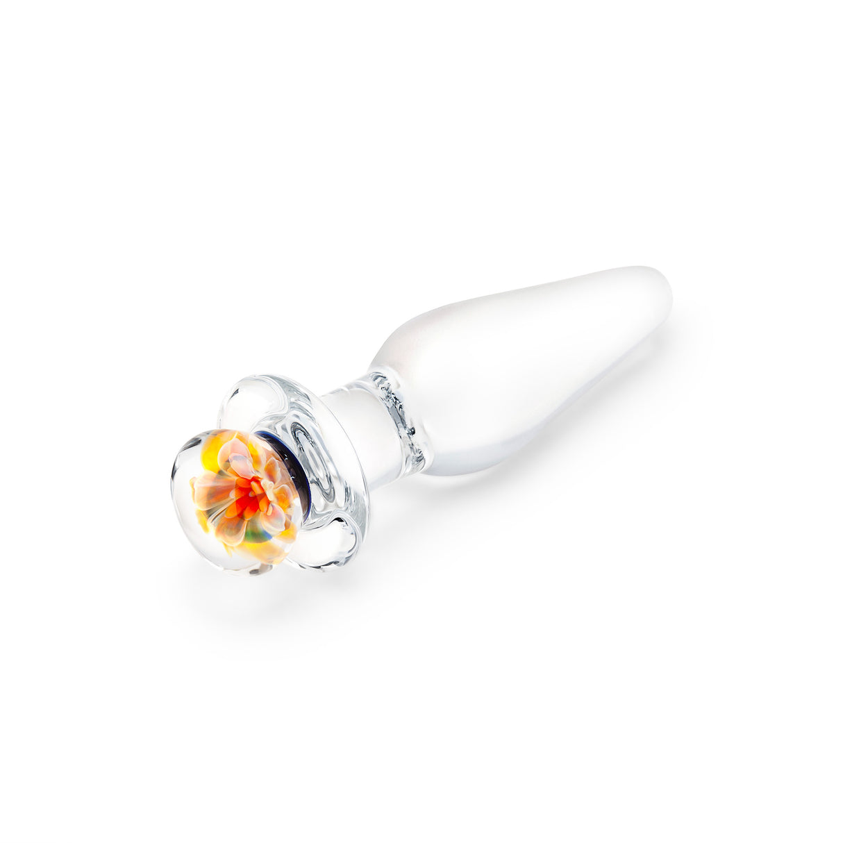 Glass anal plug with slim tapered tip and flower desing on the base on a white background