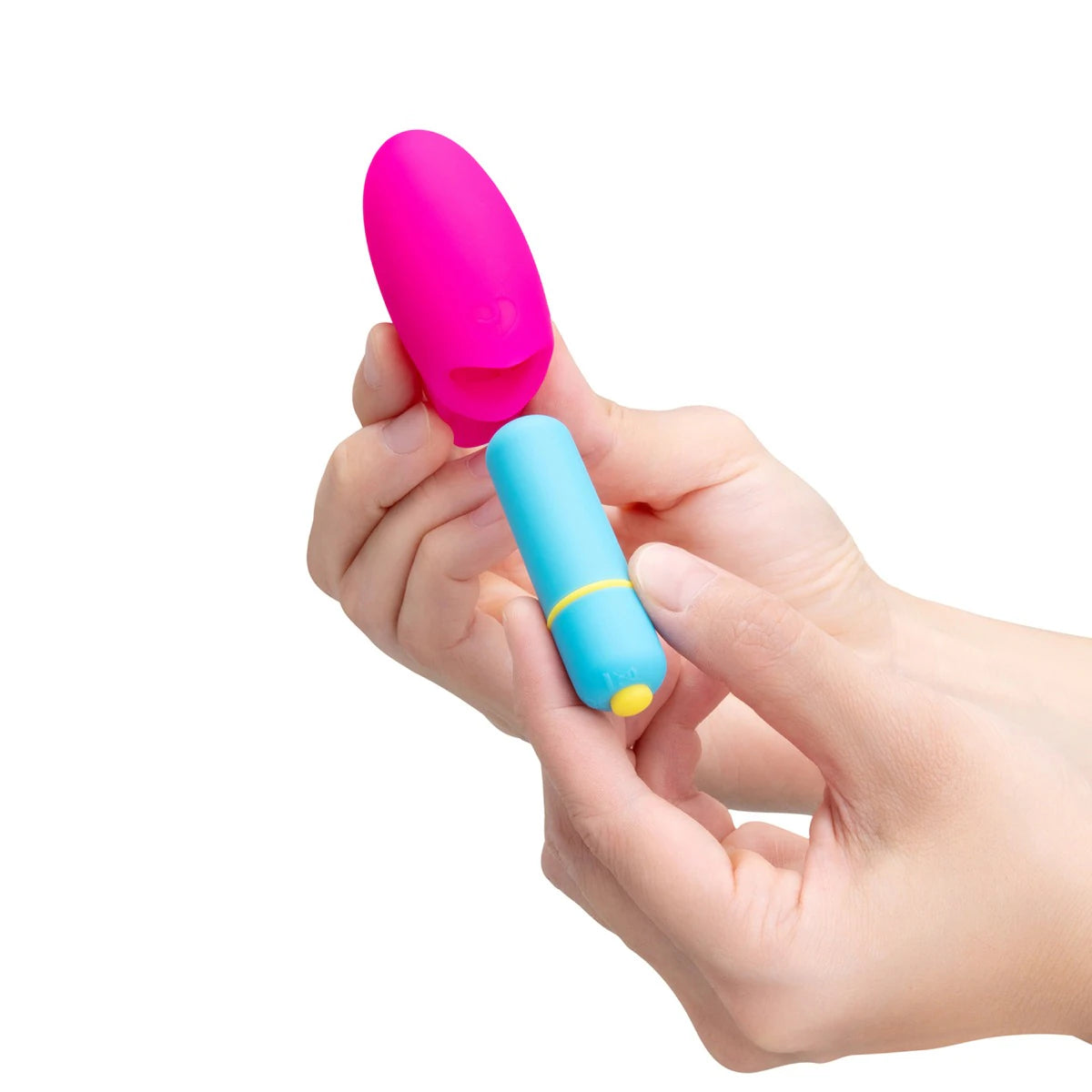 Hand holding the mini finger vibrator to show fit and scale.