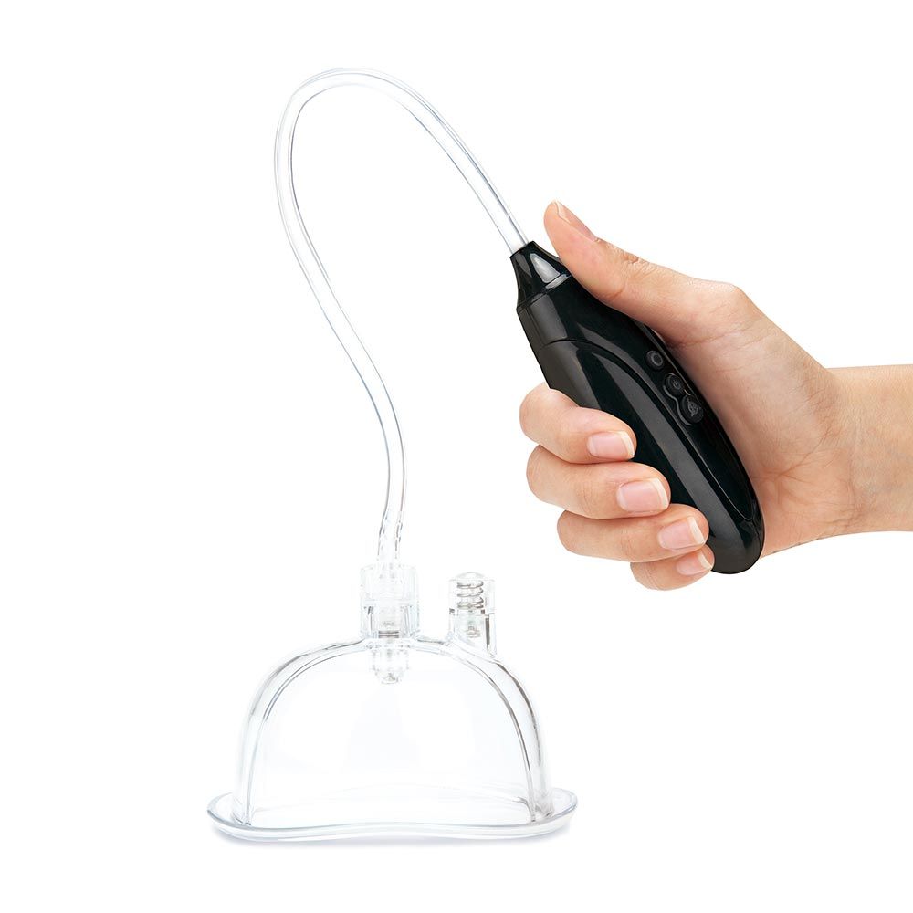 Model holding the pump of the Lux Fetish Rechargeable Pussy Pump and Clit Clamp Set