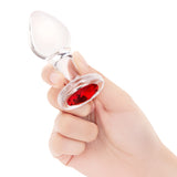 3.35" Cherry Sparkle Butt Plug - Medium handheld for scale