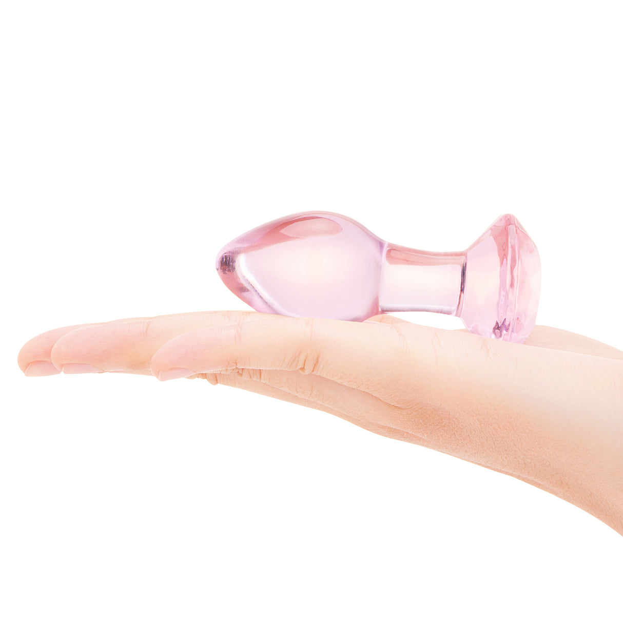 3.35" Pink Groove Butt Plug  on-Hand/Scale: Pink glass plug held in hand to demonstrate its cute, classy scale and comfortable grip.