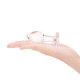 3.35" Pink Sparkle Butt Plug - Medium- scaled against palm