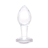 3.35" Pink Sparkle Butt Plug - Medium Clear borosilicate glass butt plug shown upright featuring a tapered shape and pink gem base.