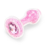 Detail View: Close-up of the flared baby pink gem base and the delicate shimmering crystals inside the glass.

