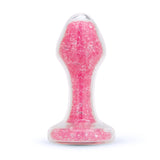 3.7" Pink Celestia Butt Plug - Medium Clear glass teardrop butt plug filled with pink crystals, shown upright with a pink gem base.