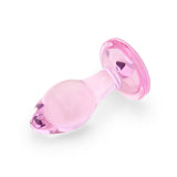 3" Bubble Gem Butt Plug - Small  Side perspective displaying the smooth pink glass curves, petite tapered tip, and wide safety anchor.