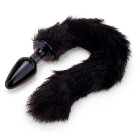 Profile Angle: Side view displaying the toy's classic tapered shape and sleek, opaque black glass body.