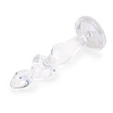 4.5" Twist and Tush Butt Plug - Large  Profile Angle: Diagonal side profile highlighting the slim neck resting above the flat, flared bottom.