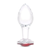 4" Cherry Sparkle Butt Plug - Large Clear borosilicate glass butt plug shown upright featuring a teardrop shape and ruby red gem base.