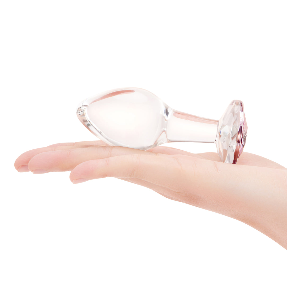 4" Pink Sparkle Butt Plug - Large- scaled against palm