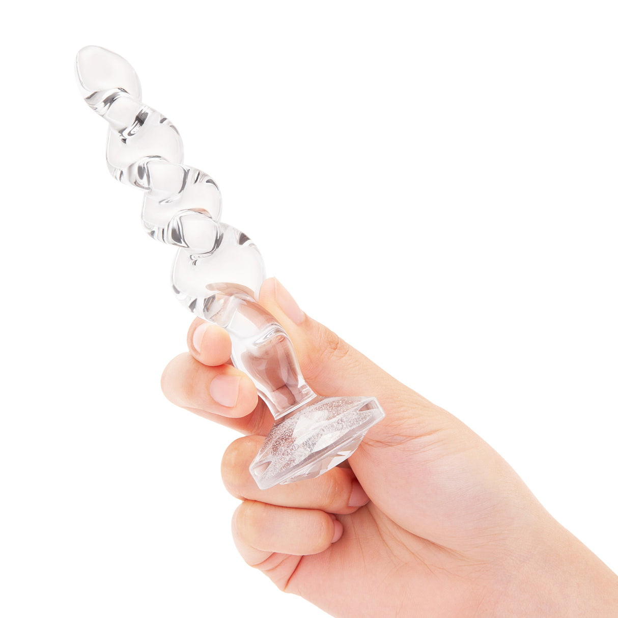 5" Sweet Swirl Dildo In-Hand/Scale: Clear glass twist dildo held in hand to demonstrate the luxurious, weighty feel and scale.

