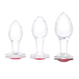 Cherry_Sparkle_Butt_Plug Three clear glass red-gem plugs grouped together to illustrate Small, Medium, and Large sizes.