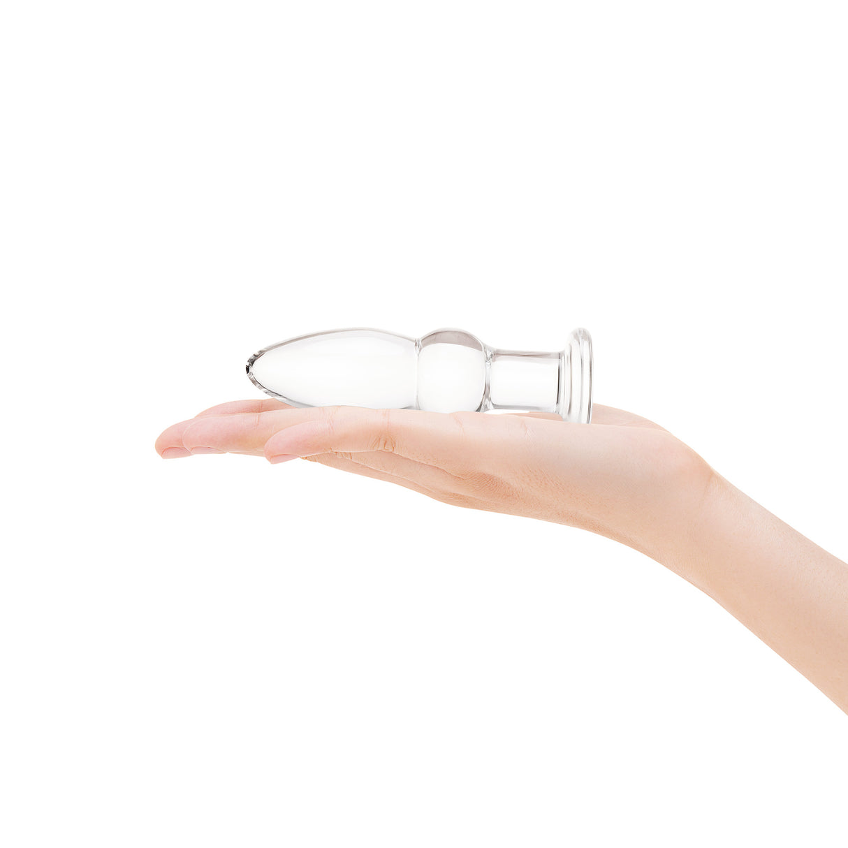 A hand holding the 4.25-inch plug to show the manageable size and the placement of the center bead.