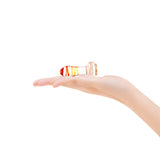 Hand holding a colorful 2.75" Monarch Plug on a white background