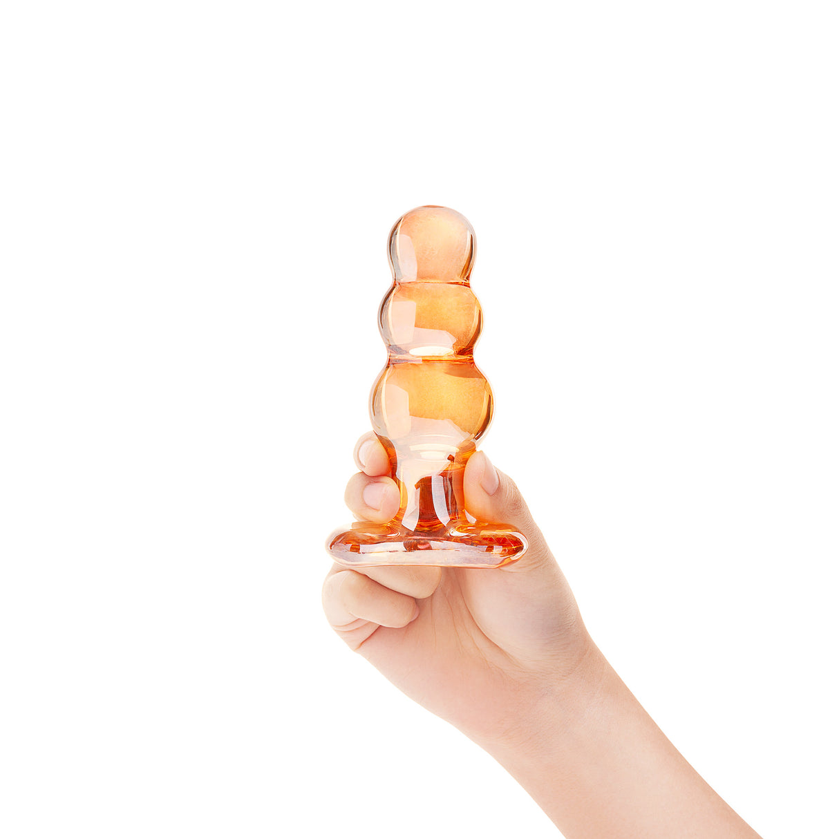 Hand holding anal beads plug object against a white background