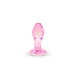 Pink heart glass butt plug on a white background