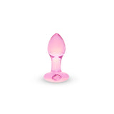Pink heart glass butt plug on a white background