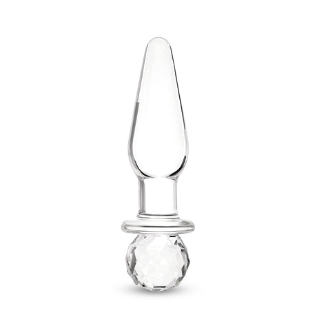Glass anal plug with round base on a white background