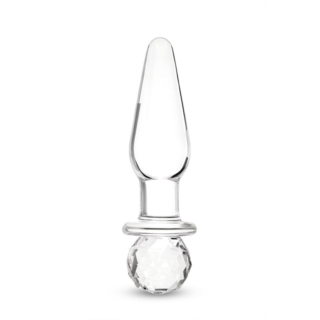 Glass anal plug with round base on a white background