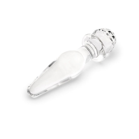 Glass anal plug with round base on a white background