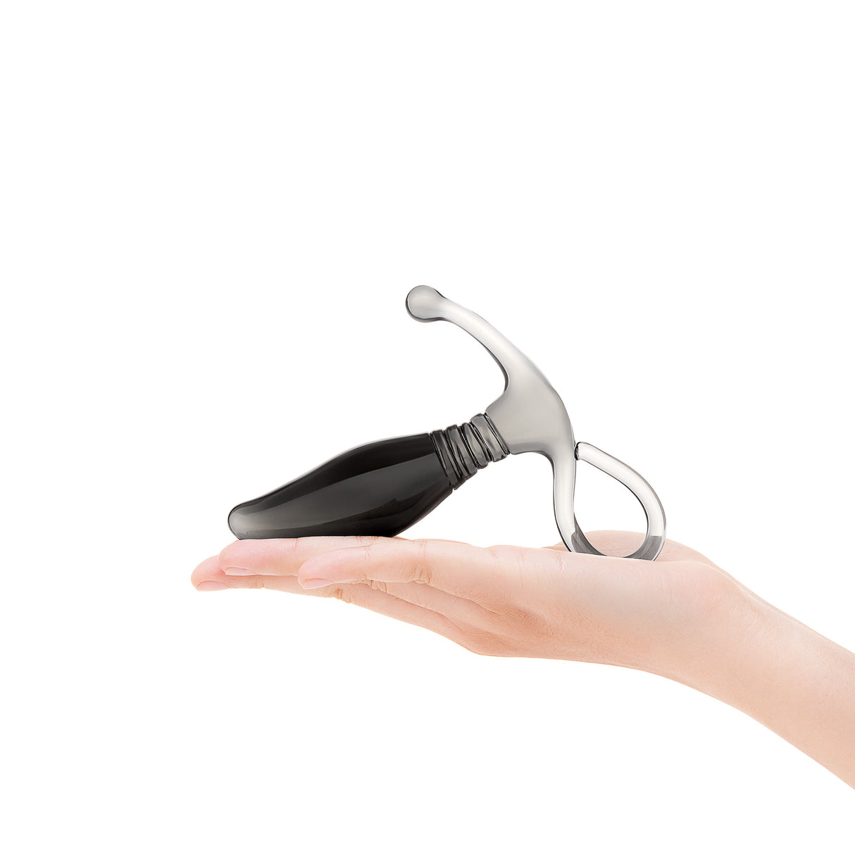 Hand holding a Glass prostate massager with a beaded base on a white background