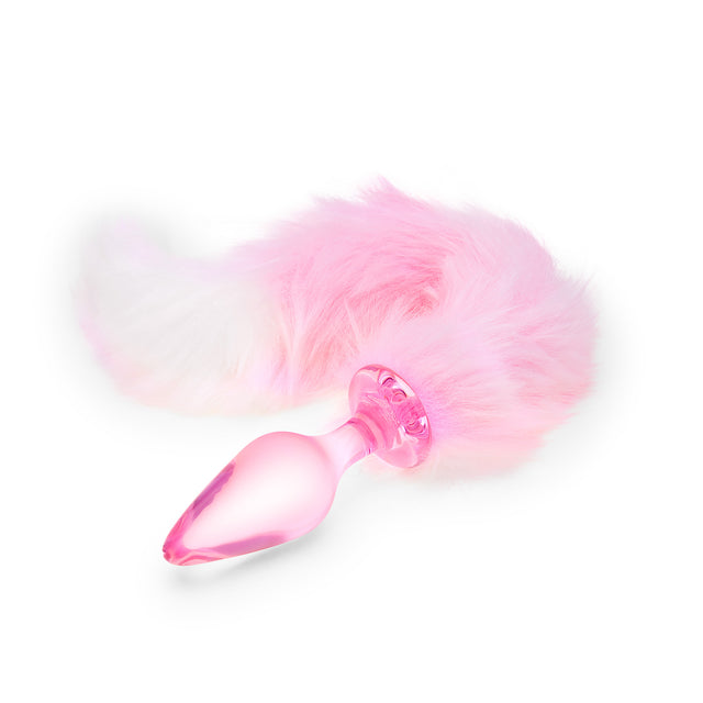 Studio shot of the Bubblegum Beast glass plug, showing the clear pink-tinted glass body and the fluffy pink-and-white faux fur tail.