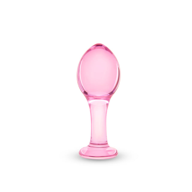 Pink glass anal plug on a white background