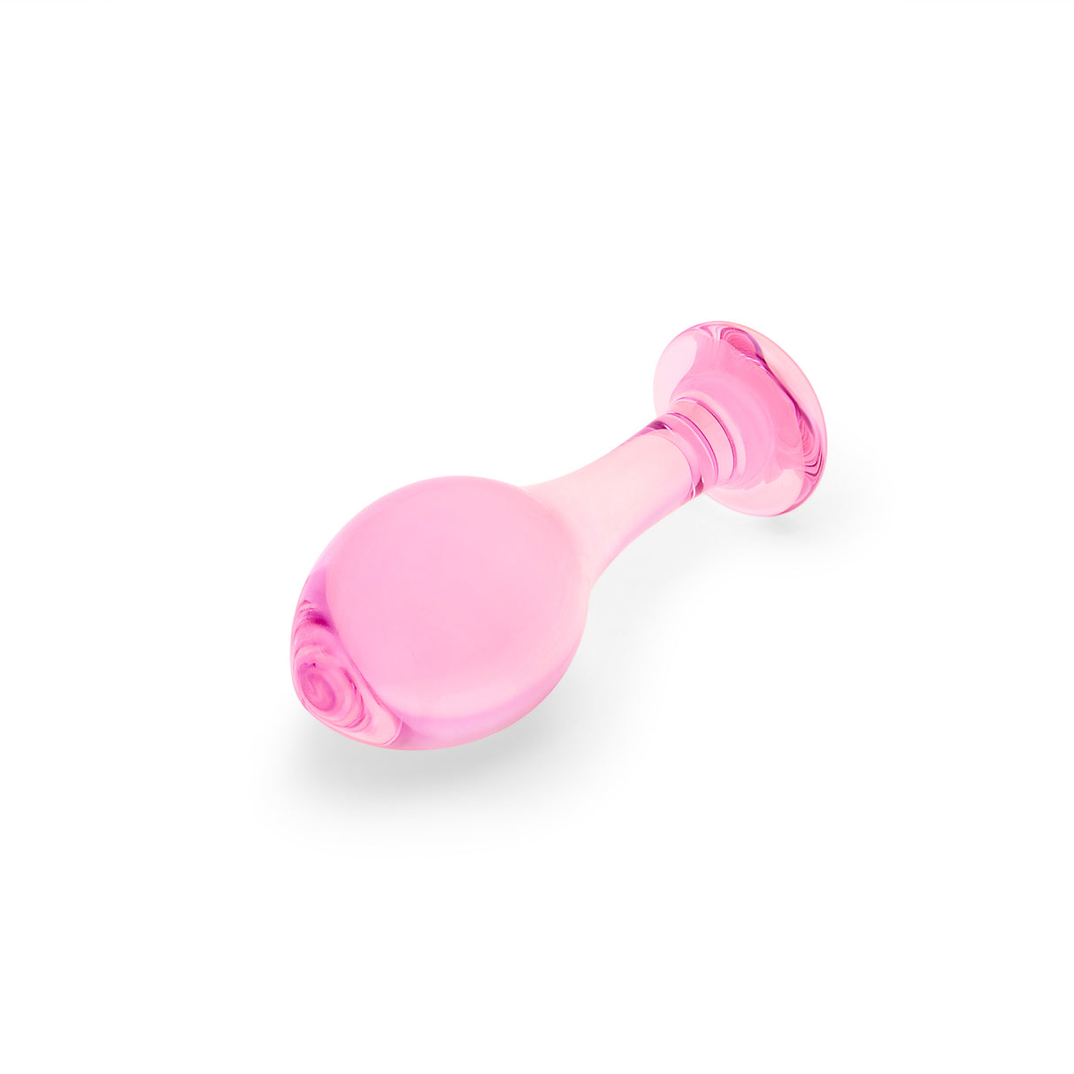 Pink glass anal plug on a white background
