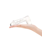Glow-in-the-Dark lifelike Glass Dildo with swirl pattern  held in a hand on a white background