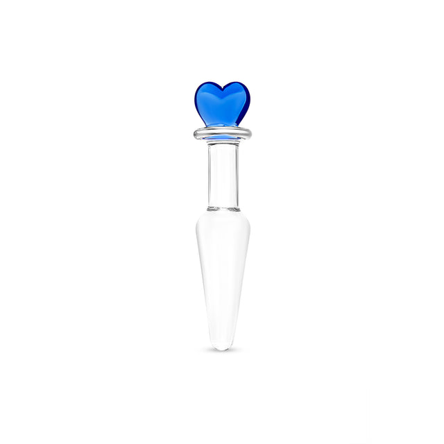 Clear glass butt plug with a blue heart-shaped base, slim neck and smooth tapered tip on a white background
