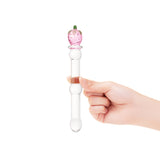 Hand holding a Strawberry Base Glass dildo featuring a rounded tip and a beaded mid-shaft body  on a white background