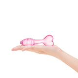 Pink Heart Base Ridged Plug featuring a tapered tip and ridget shaft on a hand against a white background