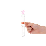 Hand holding a beaded glass dildo featuring a pink star base and mid-shaft bead on a white background