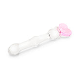 beaded glass dildo featuring a pink heart base and mid-shaft bead on a white background