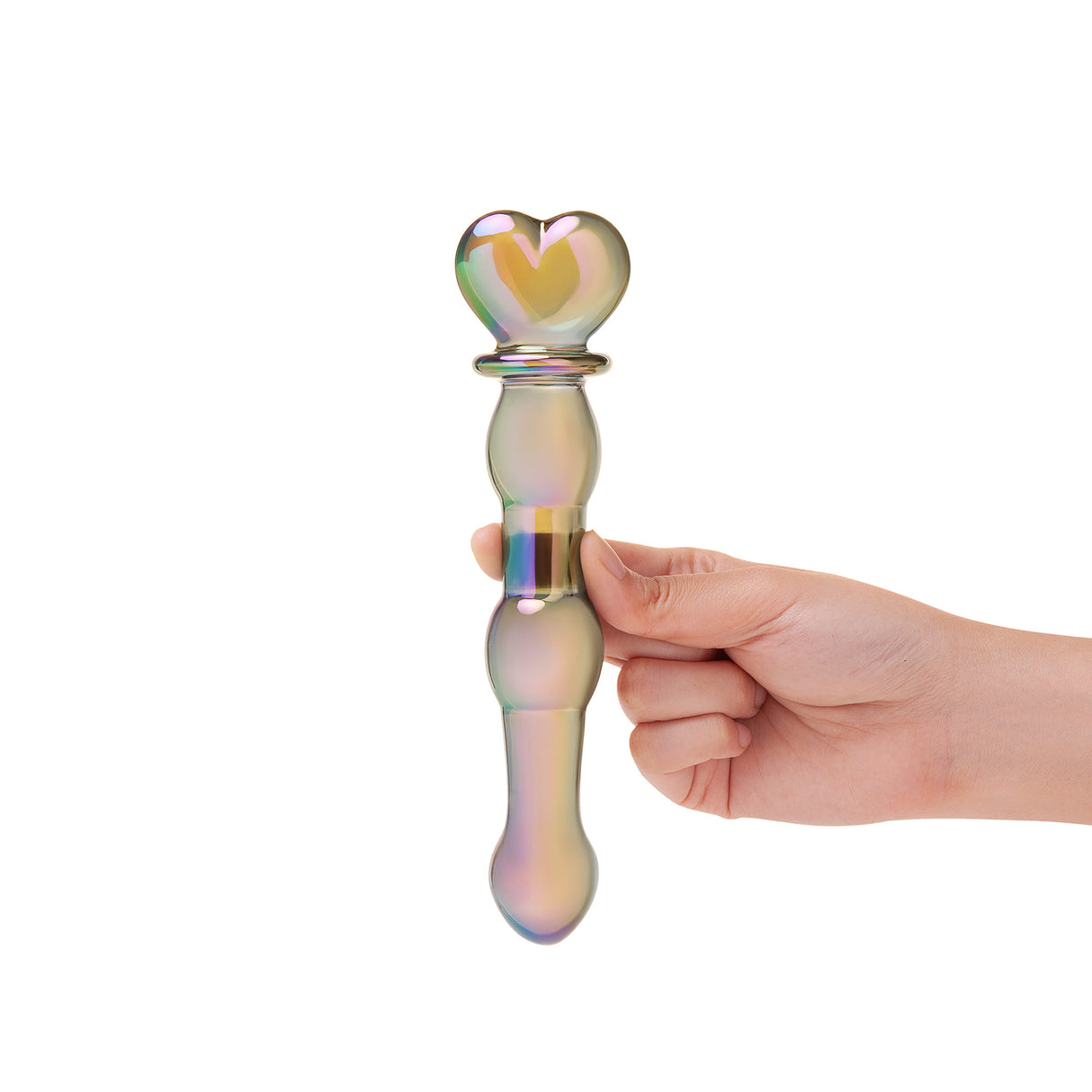 Hand holding a Glass dildo with an Iridescent Beaded Shaft and a heart base on a white background