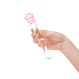 Hand holding a Beaded Shaft & Pink Flower Base Glass Dildo on a white background