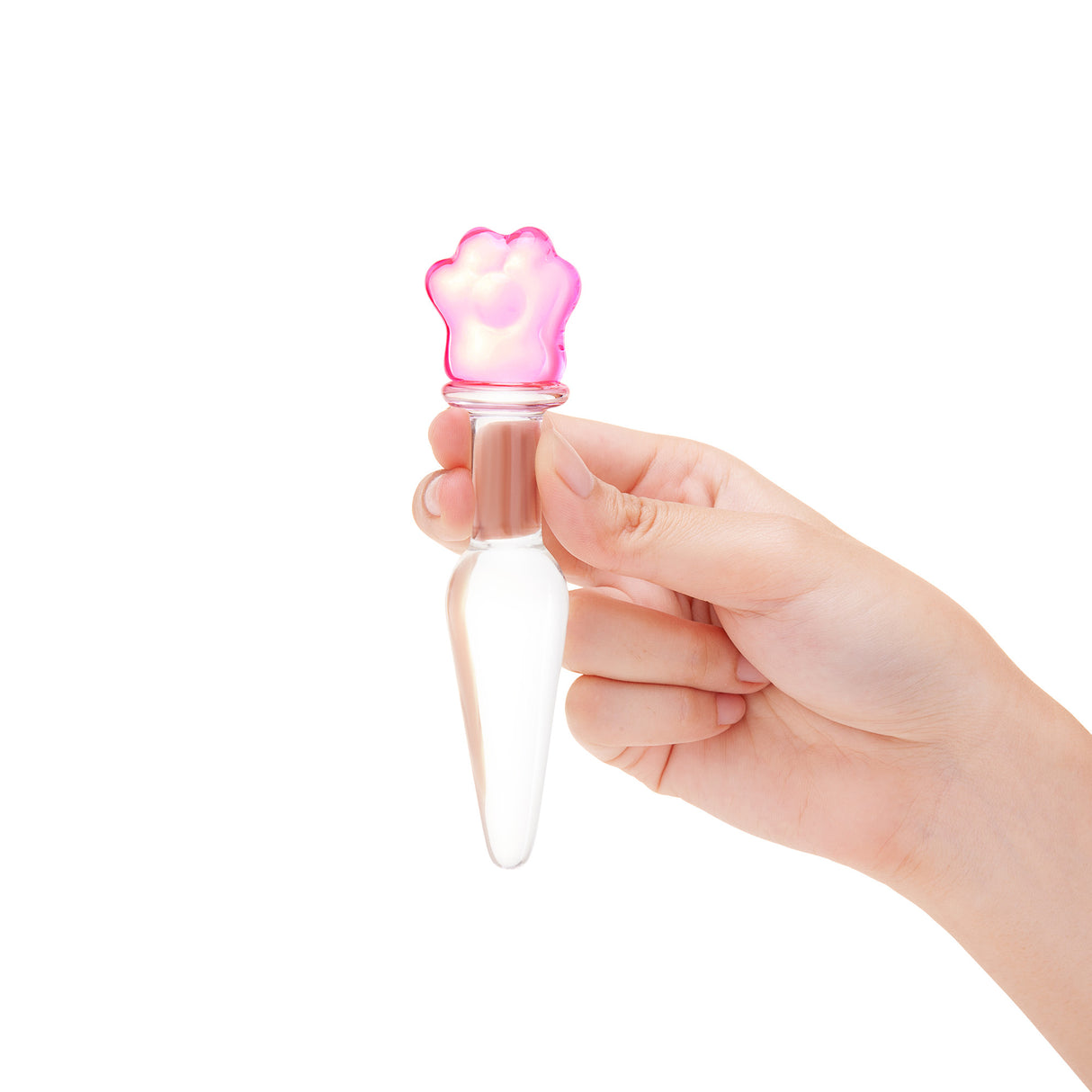 Hand holding a Glass anal plug with slim shaft, tapered tip, and a secure pink flower base on a white background