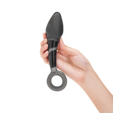 Hand holding a Bulbous Teardrop Tip Glass Dildo on a white background